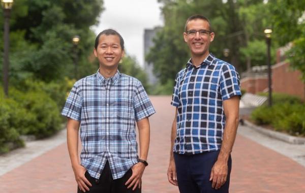 Peng Qiu, left, and Joshua Weitz are leading a new National Institutes of Heath-funded training program that will help transform the study of quantitative- and data-intensive biosciences at the Georgia Institute of Technology. (Photo: Allison Carter)