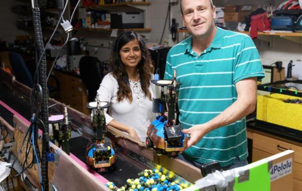 Dan Goldman and Bahnisikha Dutta with robots