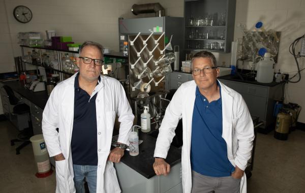 Researchers Michael Farrell (left) and Brian Hammer are working on a potential new way to boost the effectiveness of influenza vaccines. (Credit: Sean McNeil)
